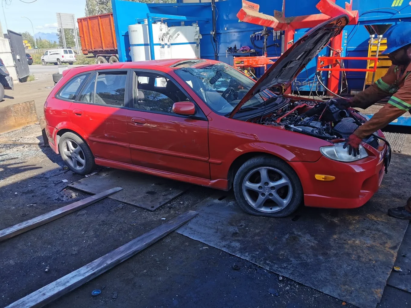 Red used car being assessed by the True North team in Chilliwack